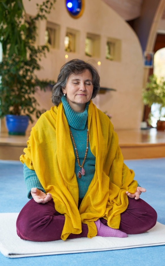 Woman sitting in Meditation on floor
