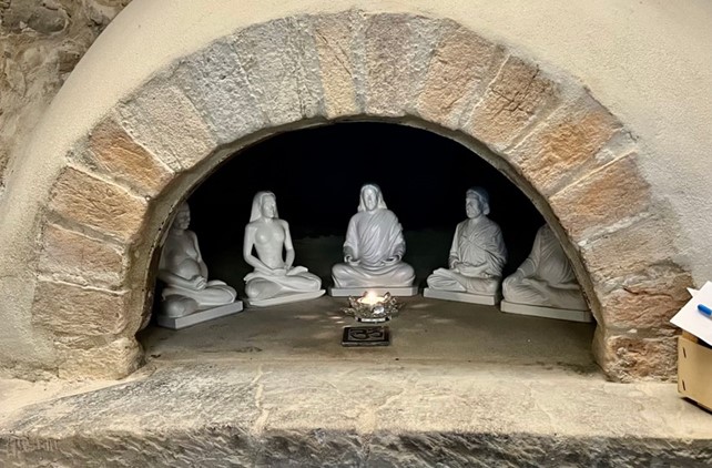 Statues of the five masters in an old pizza oven